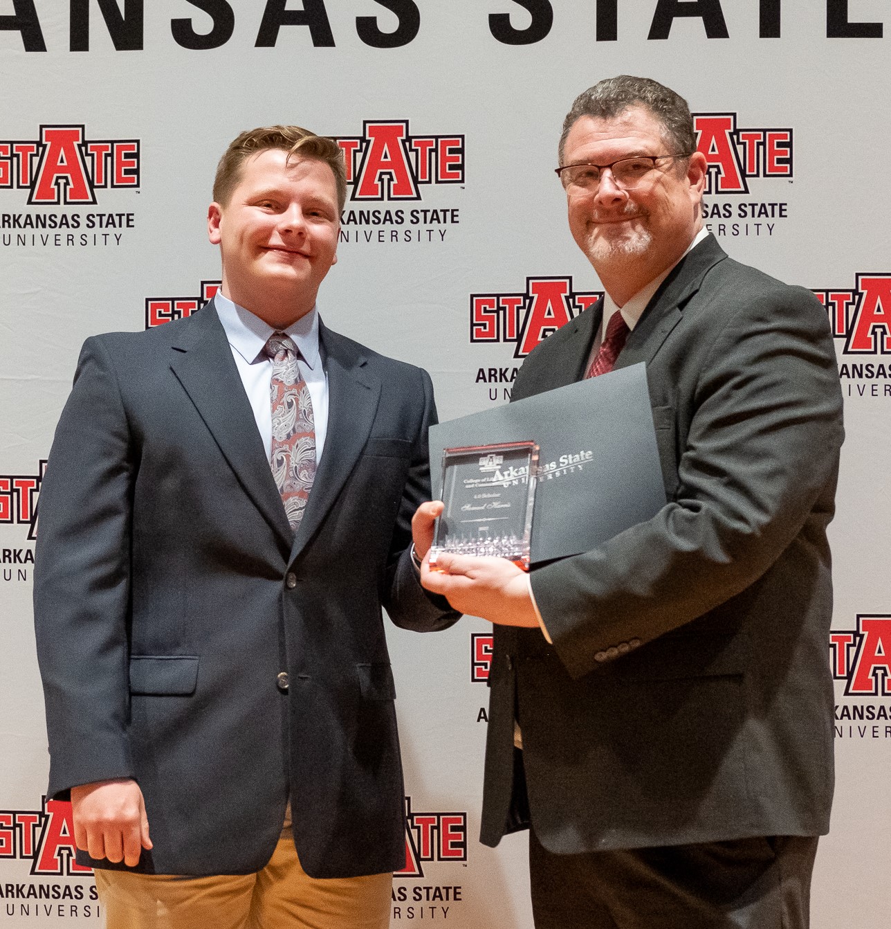 Samuel Harris receiving award